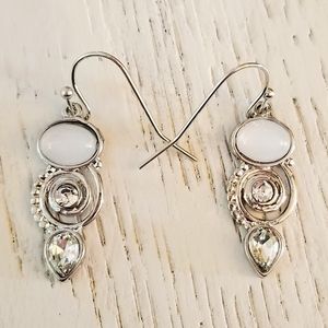 Earrings with a moonstone and rhinestones set on silver metal.